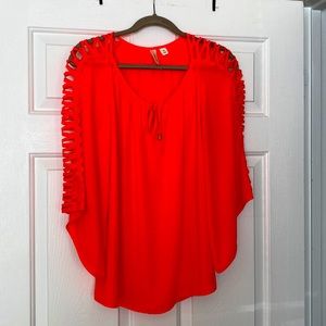 Wide 3/4 sleeve blouse with tie neck. Neon pink with open sleeve detail.